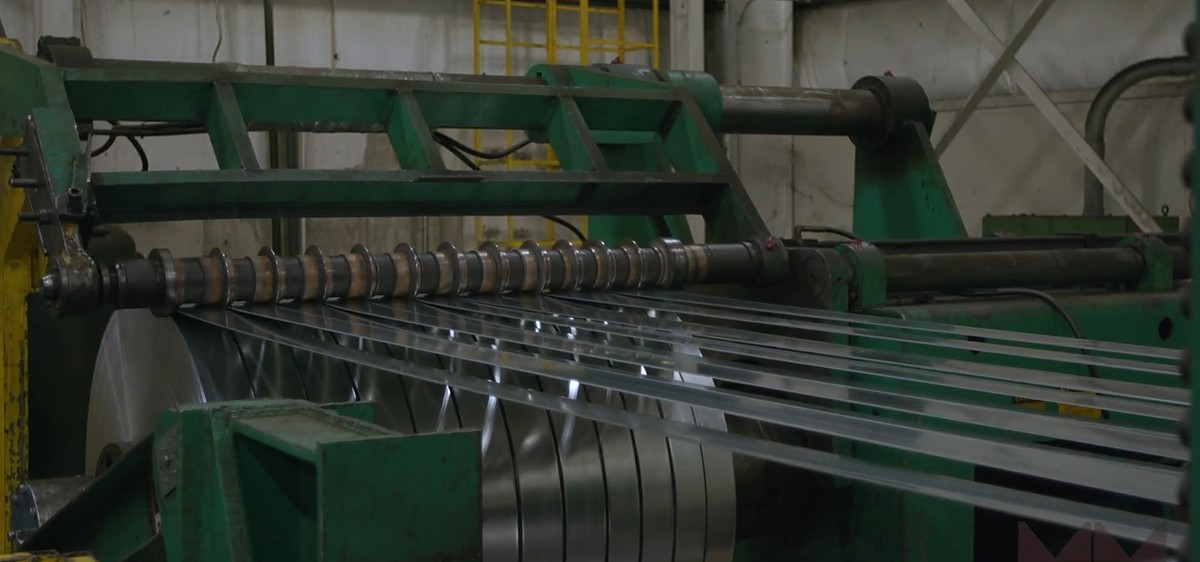 Slit steel strips coming off the 72-inch coil slitter
